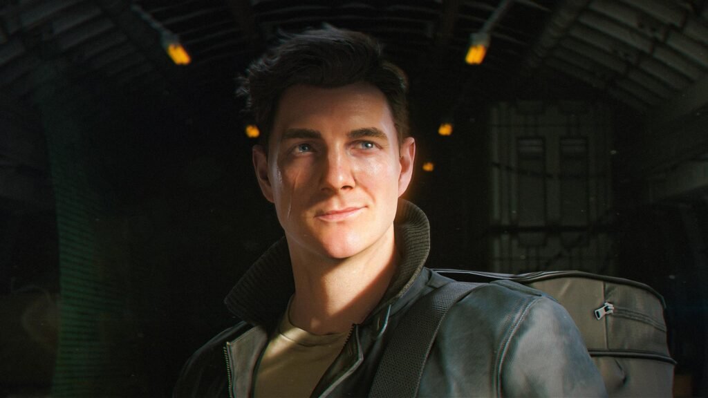 007-first-light-1-1920x1080-1bcef6df295e - GamersPack ישראל Young man with a backpack gazing upward in a dark, industrial-looking hangar or warehouse setting. 007-first-light-1-1920x1080-1bcef6df295e