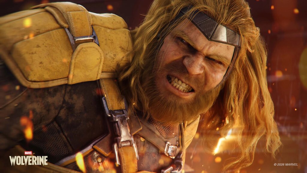 Close-up of Wolverine snarling with long blond hair, wearing a beige tactical suit and metal headband. wolverine 2